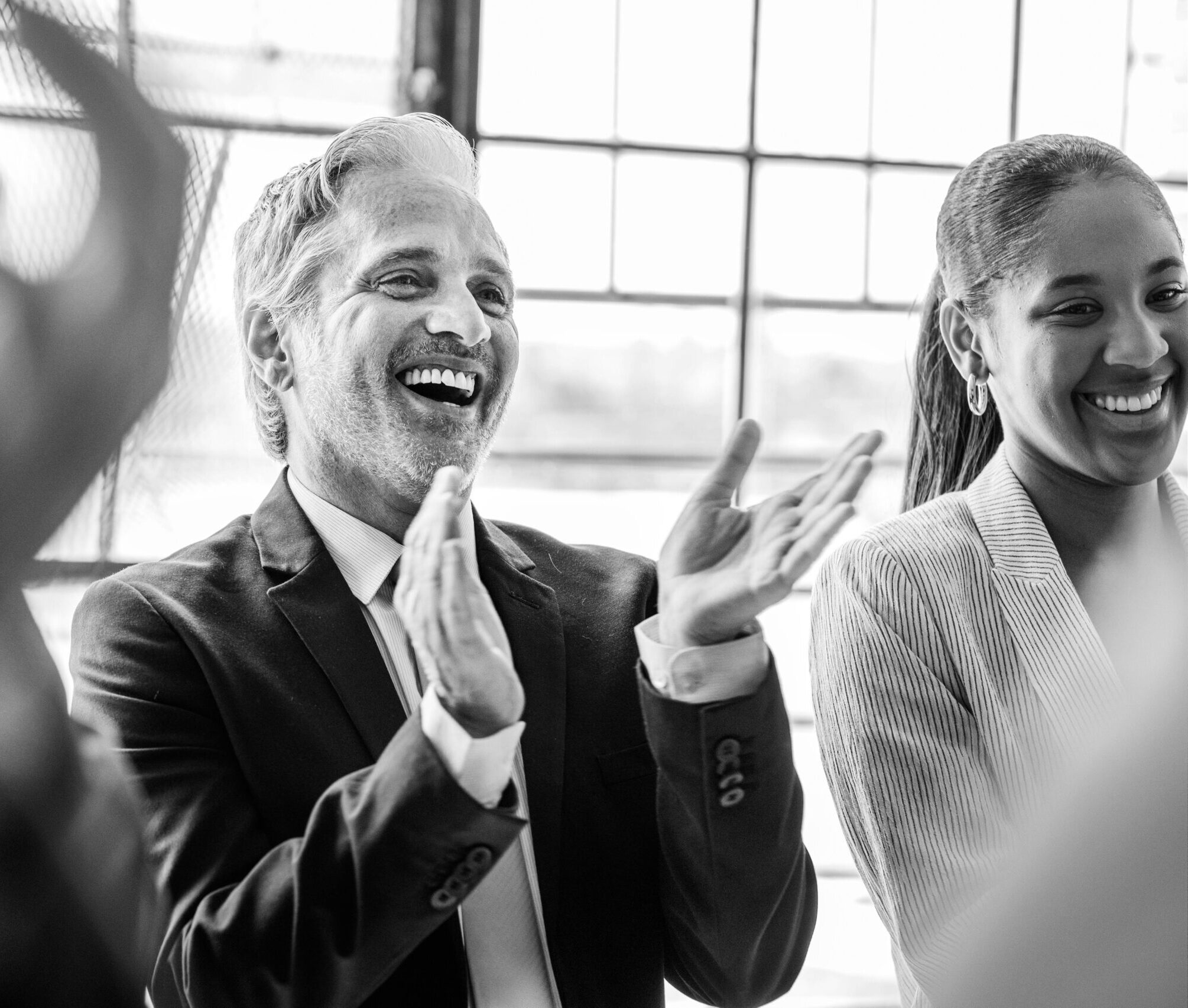 Team of business people clapping government contracting help